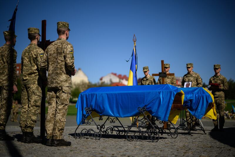 A guard of honour stands at attention during the funerals of Sgt Olexandr Moisenko and Sergiy Turpetko in Lviv, Ukraine. Getty