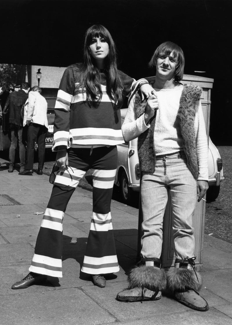 American pop singing duo, Sonny (Salvatore Bono, 1935 - 1998) and Cher (Cherilyn Sarkasian La Pier) in Northumberland Avenue, London, after making a recording for the BBC at the Playhouse Theatre. They were turned away from the Hilton Hotel by the management because of their appearance.    (Photo by Fred Mott/Getty Images)