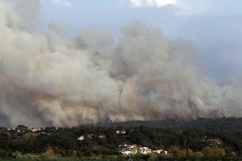 Thick smoke rises from a forest fire in Condeixa, central Portugal. Paulo Cunha / EPA