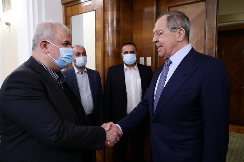 Russian Foreign Minister Sergey Lavrov shakes hands with Mohammad Raad, head of the parliamentary bloc of Lebanon's Hezbollah movement, during a meeting in Moscow. Reuters