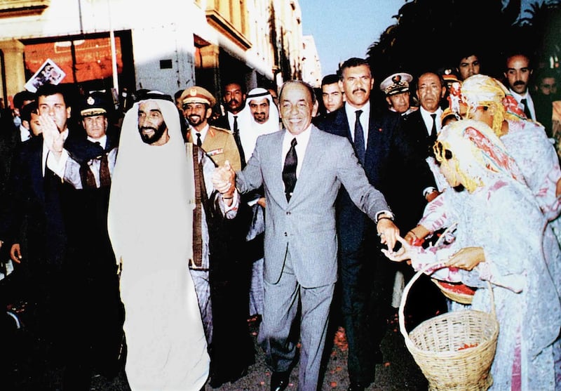 United Arab Emirates President Sheikh Zayed bin Sultan Al Nahyan (L) walks in a Rabat street with the late Moroccan monarch, King Hassan II, during a visit to Morocco in 1980. (Photo by WAM / AFP)
