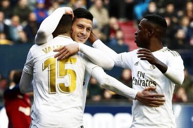 epa08206093 Real Madrid's Luka Jovic (C) celebrates with teammates Federico Valverde (L) and Vinicius Junior (R) after scoring the 4-1 lead during the Spanish La Liga soccer match between CA Osasuna and Real Madrid at El Sadar stadium in Pamplona, northern Spain, 09 February 2020. EPA/JESUS DIGES