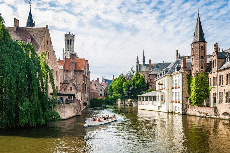 Bruges and Ghent in Belgium are wonderful places to stay for a few days, but Bruges is arguably the more popular destination. Above, a view of the the Bruges Canal. Getty Images