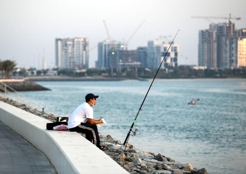 Evening-AD Resident fishing along Yas Beach, in Abu Dhabi on June 3, 2021. Khushnum Bhandari / The National 
Reporter: N/A News