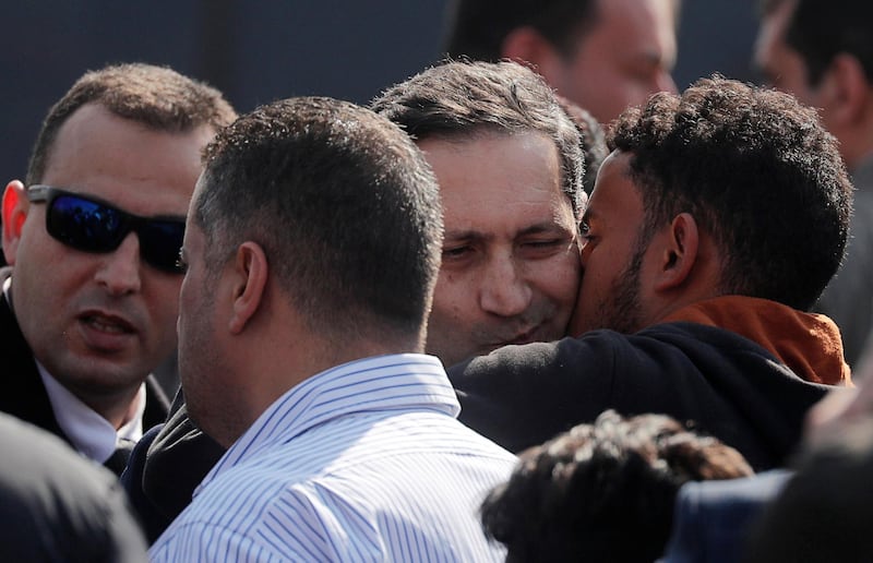 Alaa, son of former Egyptian President Hosni Mubarak, is consoled during his father's funeral. Reuters