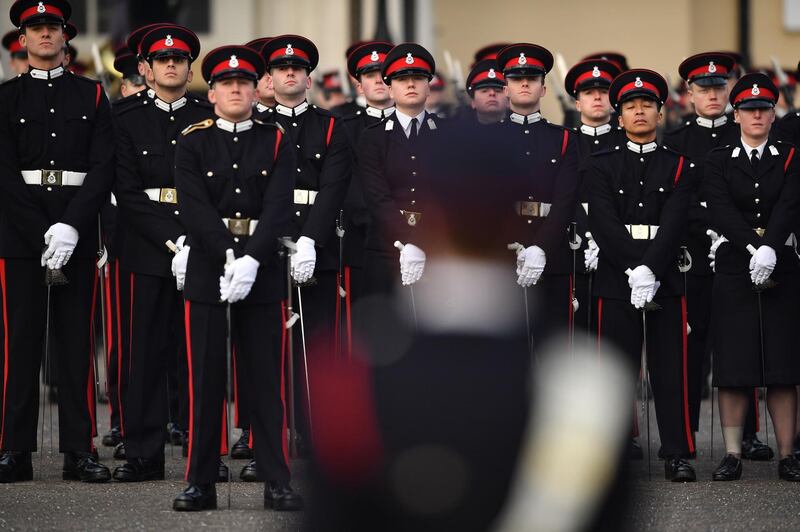 Officer cadets stand to attention.  AFP