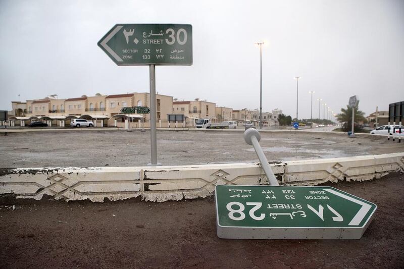 Gusts from Wednesday's storm were strong enough to topple street signs in Khalifa City. Christopher Pike / The National