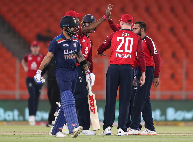 England celebrate the dismissal of India's Virat Kohli for just one run. AP