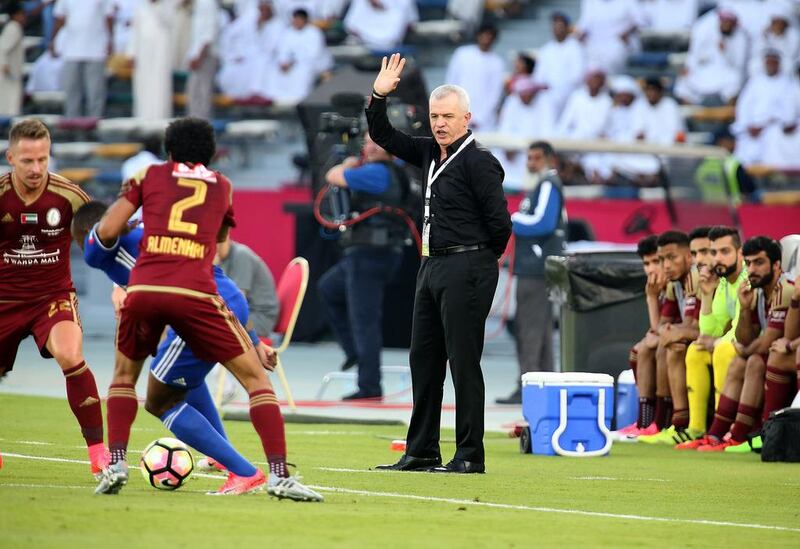 Javier Aguirre watches on from the touchline during Al Wahda's President's Cup final victory on Friday. The Mexican is set to be replaced as Wahda manager by Romanian Laurențiu Reghecampf. Pawan Singh / The National