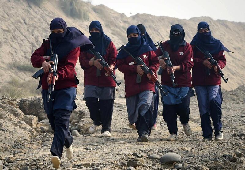 Female Pakistani police commandos during an exercise at a police training centre in Nowshera, a district in the Khyber Pakhtunkhwa Province. The army has been waging a major offensive against long-standing Taliban and other militant strongholds in the restive tribal areas on the Afghan border for the last six months. A. Majeed / AFP 