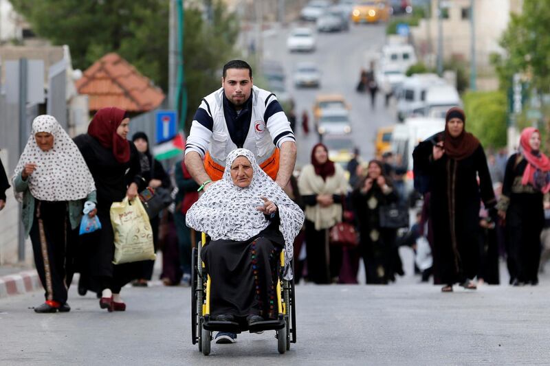 Palestinians make their way to attend the first Friday prayers at Al Aqsa mosque. Reuters