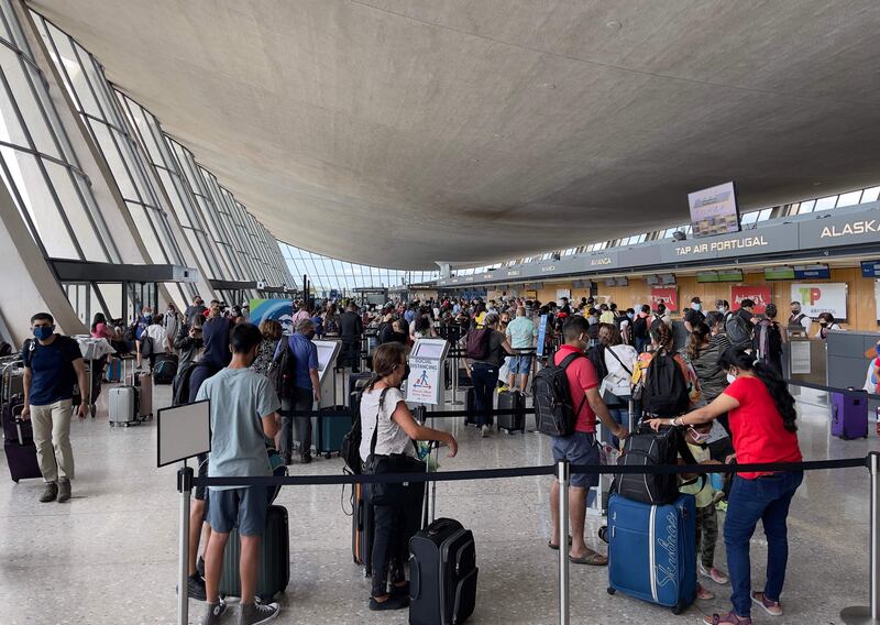 Passengers queue at Dulles Washington International Airport in Virginia. The travel industry is slowly recovering as more and more countries relax restrictions. AFP