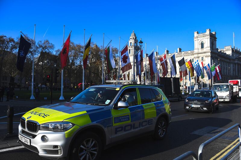 A police car drives past Parliament Square, ahead of the NATO summit, in London, Monday, Dec. 2, 2019. NATO leaders will gather in London on Tuesday as the worldâ€™s biggest military alliance, marking its 70th birthday, battles with one of the most confounding of adversaries: Itself. (AP Photo/Alberto Pezzali)