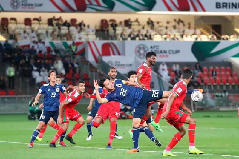 Japan's Maya Yoshida (22) kicks the ball. AFP