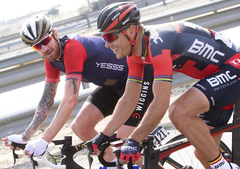 epa05141125 British rider Bradley Wiggins (L) of Team Wiggins and Belgian rider Philippe Gilbert (R) of the BMC Racing Team in action during the first stage of the Dubai Tour 2016 cycling race from Dubai to Fujairah, United Arab Emirates, 03 February 2016.  EPA/CLAUDIO PERI
