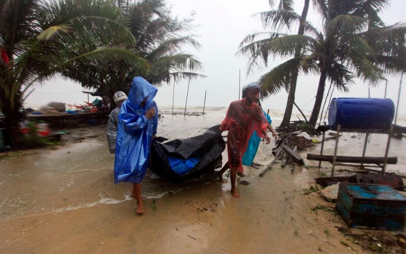 Locals clear the shoreline in preparation for the approaching Tropical Storm Pabuk, in Pak Phanang, in the southern province of Nakhon Si Thammarat, southern Thailand. AP Photo