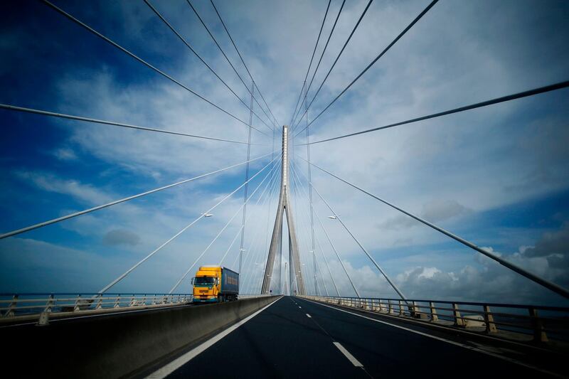 A lorry crosses the Normandy Bridge over the River Seine at Le Havre, northwestern France. Charly Triballeau / AFP Photo