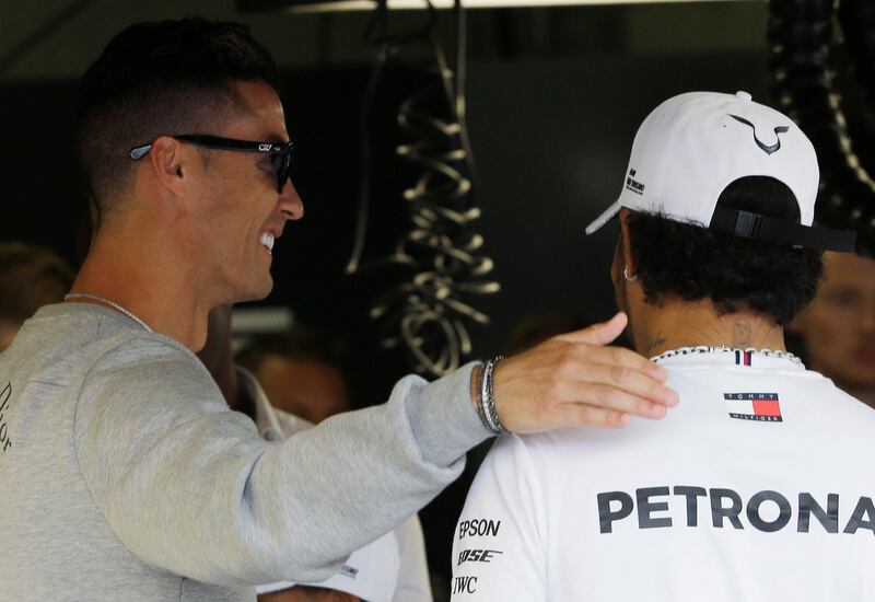 Ronaldo with Hamilton. AP Photo