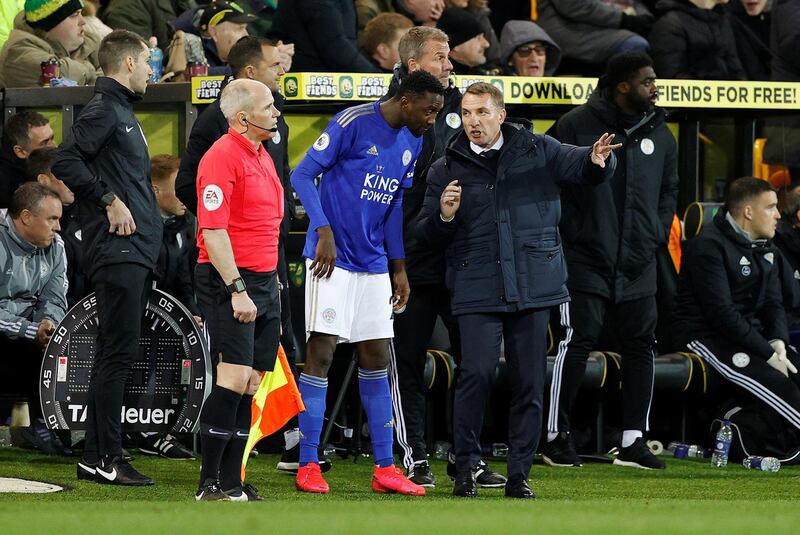 Leciester manager Brendan Rodgers, right, talks to substitute Wilfred Ndidi before the midfielder's introduction. Reuters
