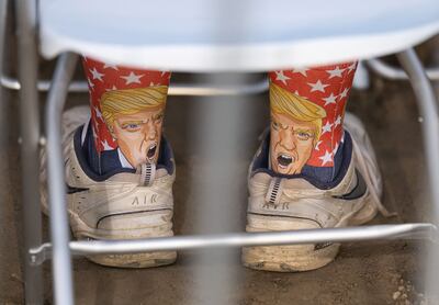 A rally-goer wears Trump socks while watching former US president Donald Trump speak at an event in Delaware, Ohio, on April 23.  AFP