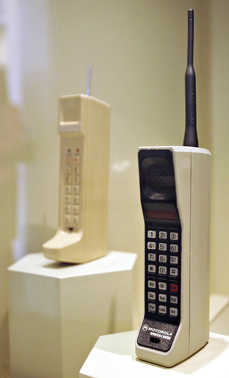 A 1984 Motorola DynaTAC 8000X, the world's first commercially available portable phone, right, and a 1973 DynaTAC prototype, left. Bloomberg