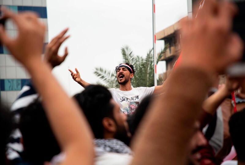 Iraqi students take part in an anti-government protest in the southern city of Basra.  AFP
