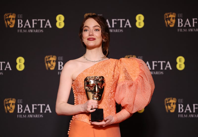Emma Stone with her Bafta for Leading Actress in Poor Things. Reuters