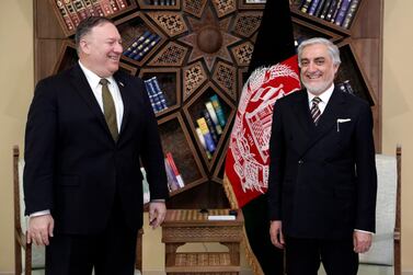 U.S. Secretary of State Mike Pompeo, left, stands with Abdullah Abdullah the main political rival of President Ashraf Ghani at the Sepidar Palace, in Kabul. Sepidar palace via AP