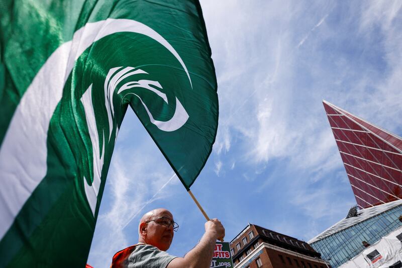 An RMT member pickets outside Victoria station in London. Reuters