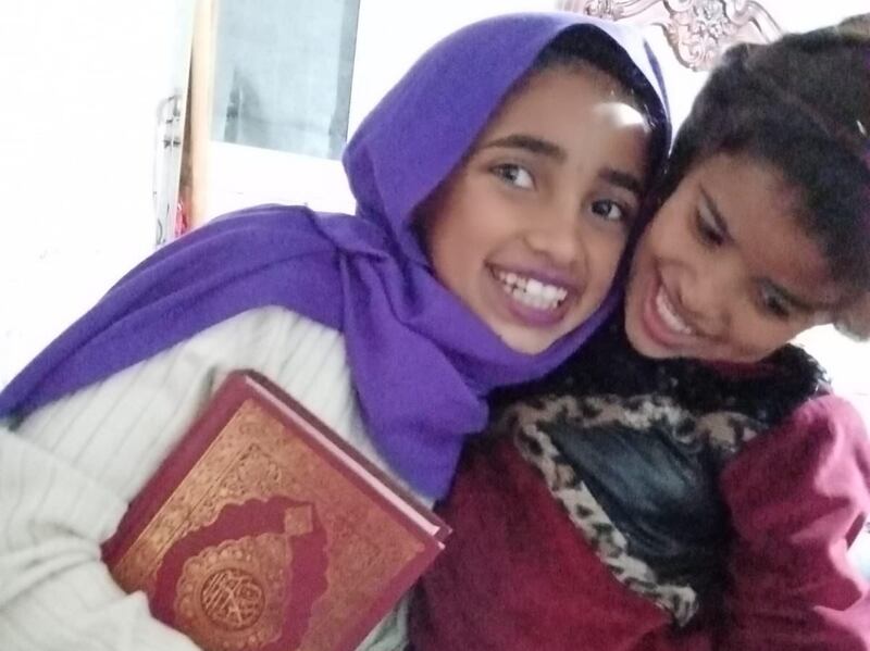 Ruqaya with her 11-year-old sister Ghazlan Jahilin (wearing the purple hijab).