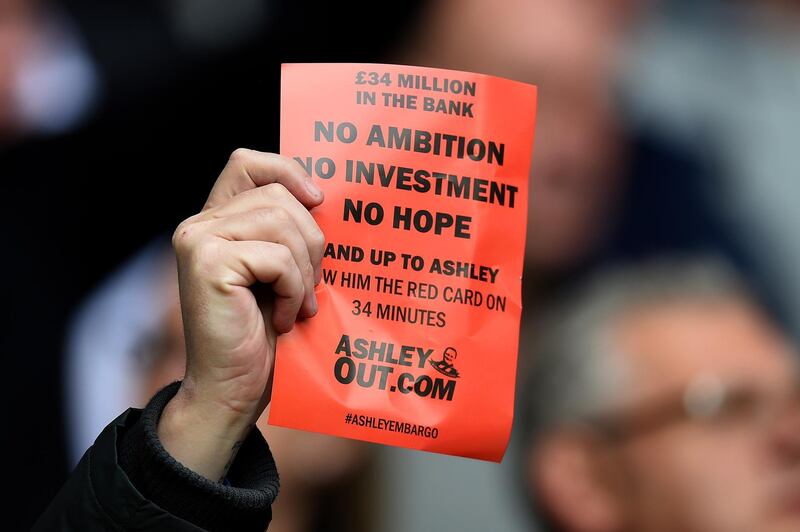 A Newcastle fan protests against owner Mike Ashley during the Premier League match between Leicester City and Newcastle United at the King Power Stadium on May 2, 2015. Getty