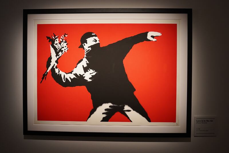 Love is in the Air (Flower thrower) by Banksy, on display at The Art of Banksy exhibition, the world's largest collection of original and authenticated Banksy artworks featuring more than 110 pieces from the anonymous Bristol-based artist. All photos: PA