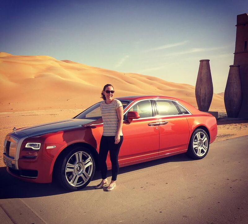 Melinda Healy alongside her pricey ride in the Rub Al Khali desert.