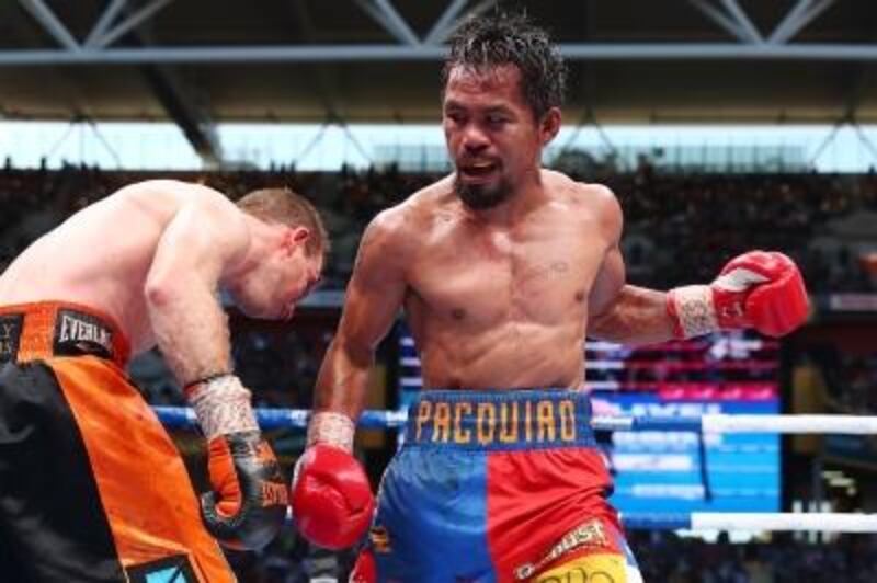 Manny Pacquiao of the Philippines, right, during his WBO World Welterweight title defeat to Australia's Jeff Horn at Suncorp Stadium on July 2, 2017 in Brisbane, Australia.  Chris Hyde / Getty Images