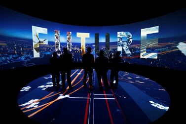 Visitors watch a 3D presentation during an exhibition on 'Neom', a new business and industrial city, in Riyadh, Saudi Arabia. Reuters.