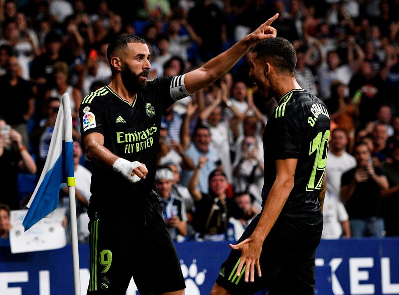 Karim Benzema celebrates scoring Real Madrid's second goal with teammates. Reuters