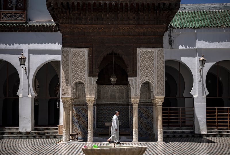 Although off-limits to tourists, some take advantage of the doors being opened shortly before prayers to snap photos in the courtyard.