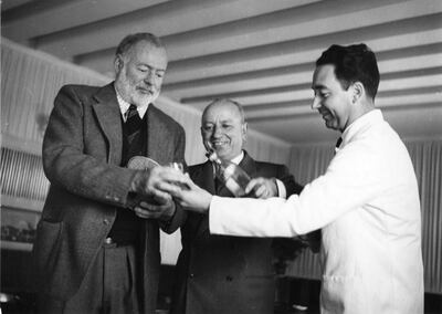 EH3716P      1949
Ernest Hemingway, Giuseppe Cipriani (owner of Harry's Bar), and server at Harry's Bar, Venice. Please credit "Ernest Hemingway Photograph Collection in the John F. Kennedy Presidential Library and Museum, Boston."