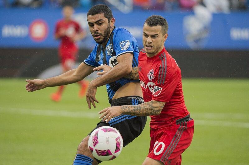 Montreal Impact's Victor Cabrera, left, challenges Toronto FC's Sebastian Giovinco during first half MLS match in Montreal, Sunday, October 16, 2016. Graham Hughes / AP Photo 
