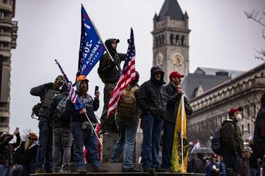 Supporters of President Trump gather in Freedom Plaza on Tuesday evening, ahead of all-day demonstrations on Wednesday, the day Congress is meeting to certify the 2020 election results. Mr Trump is slated to speak at a rally Wednesday. AFP