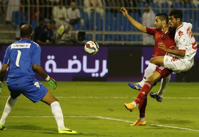 UAE and Oman players tussle during their 0-0 Gulf Cup draw in Riyadh. AFP