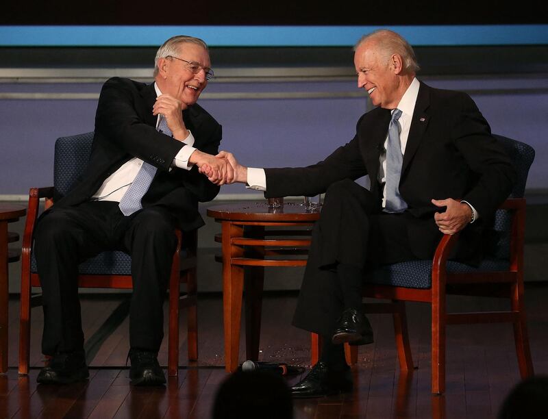 Former US vice president Joe Biden, right, shakes hands with Mondale during an event to honour him at George Washington University. AFP/Getty Images