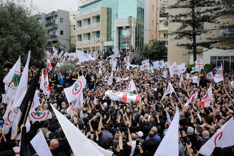 Supporters of the Lebanese Forces take to the streets and wave the party's flag. AFP