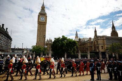 The coffin of Queen Elizabeth is pulled past Parliament Square following her funeral service in Westminster Abbey. AP