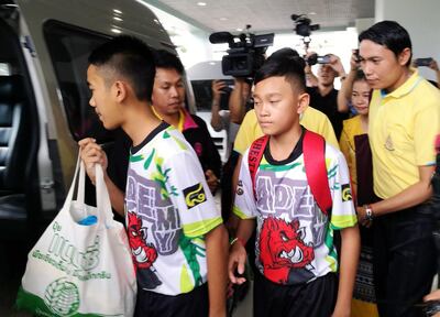epa06896127 Some of the rescued twelve members of the Wild Boar soccer team depart from the Chiangrai Prachanukroh Hospital in Chiang Rai province, Thailand, 18 July 2018. The 13 members of the Wild Boar child soccer team, including their assistant coach, who were trapped in the Tham Luang cave since 23 June 2018, will make their first appearance for a tightly-controlled interview with media after they were rescued, before returning to their homes with families.  EPA/CHAICHAN CHAIMUN