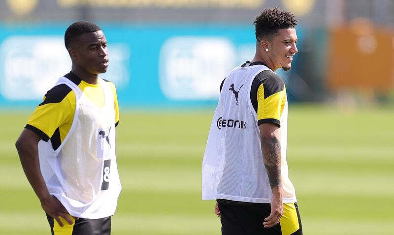 Jadon Sancho and Youssoufa Moukoko attend a training session with Borussia Dortmund at the team training grounds in Dortmund. EPA