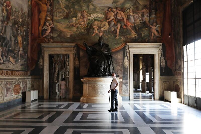 ROME, ITALY - MAY 19: A museum employee wearing a face mask stands in one of the rooms of the Capitoline Museums on the first day of opening after more than two months of lockdown on May 19, 2020 in Rome, Italy. Museums, restaurants, bars, cafes, hairdressers and other shops have reopened, subject to social distancing measures, after more than two months of a nationwide lockdown meant to curb the spread of Covid-19. Churches are starting to celebrate Mass again, but there will be strict social distancing and worshippers must wear face masks. And citizens will no longer be required to justify their movements with self-certification. (Photo by Marco Di Lauro/Getty Images)