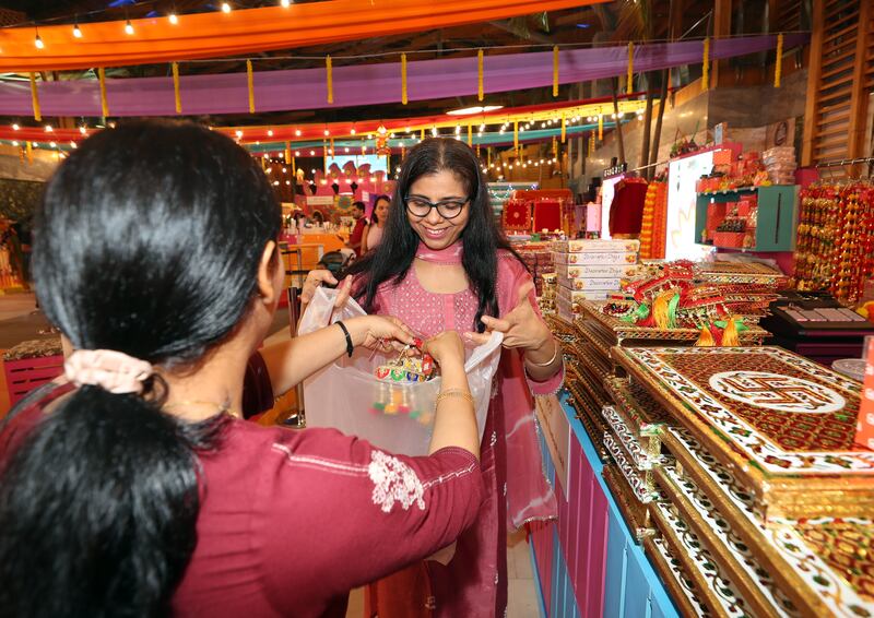 Jypi Hhira shops for decorations at Diwali Bazaar in BurJuman Mall. Chris Whiteoak / The National