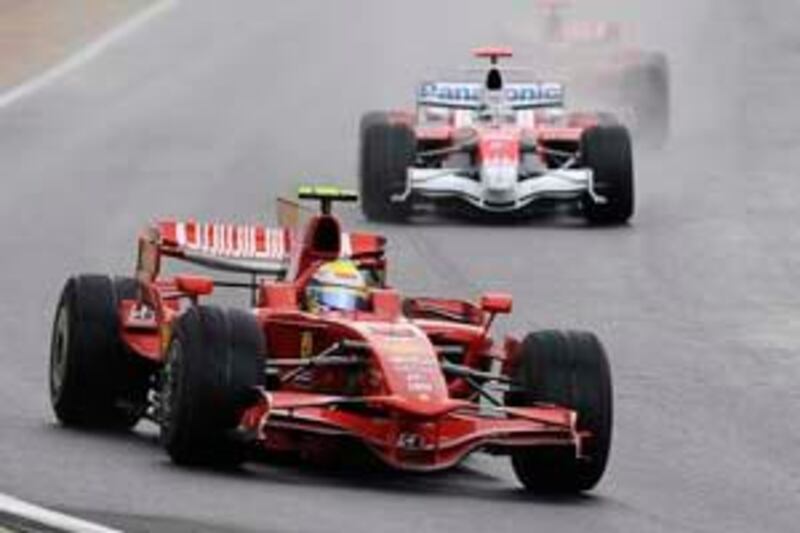 Ferrari's Formula One driver Felipe Massa of Brazil leads the pack as Toyota's Formula One driver Jarno Trulli of Italy, center, Ferrari's Formula One driver Kimi Raikkonen of Finland, behind Trulli, and McLaren Mercedes' Formula One driver Lewis Hamilton of Britain, top right, follow after the start of the Brazilian Formula One Grand Prix on the Interlagos Circuit in Sao Paulo, Sunday, Nov. 2, 2008. The race is the last Formula One race in the 2008 season.   (AP Photo/Oliver Multhaup)