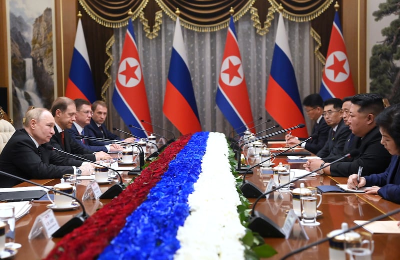 Mr Putin and Mr Kim lead their delegations in talks on June 19. AP / Sputnik